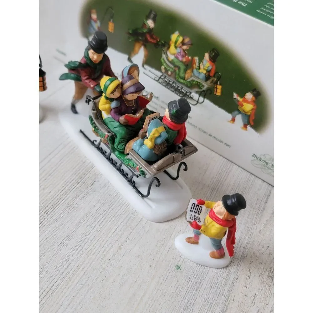 Dept 56 58396 Caroling With The Cratchit Family (Revisited) village accessory xm